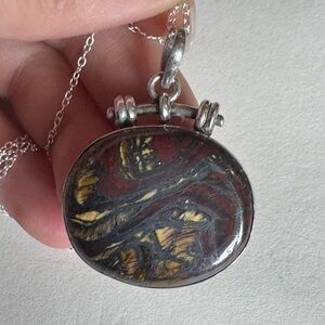 Elegant Sterling Silver and Gold Pendant Necklace on a 20”
Chain